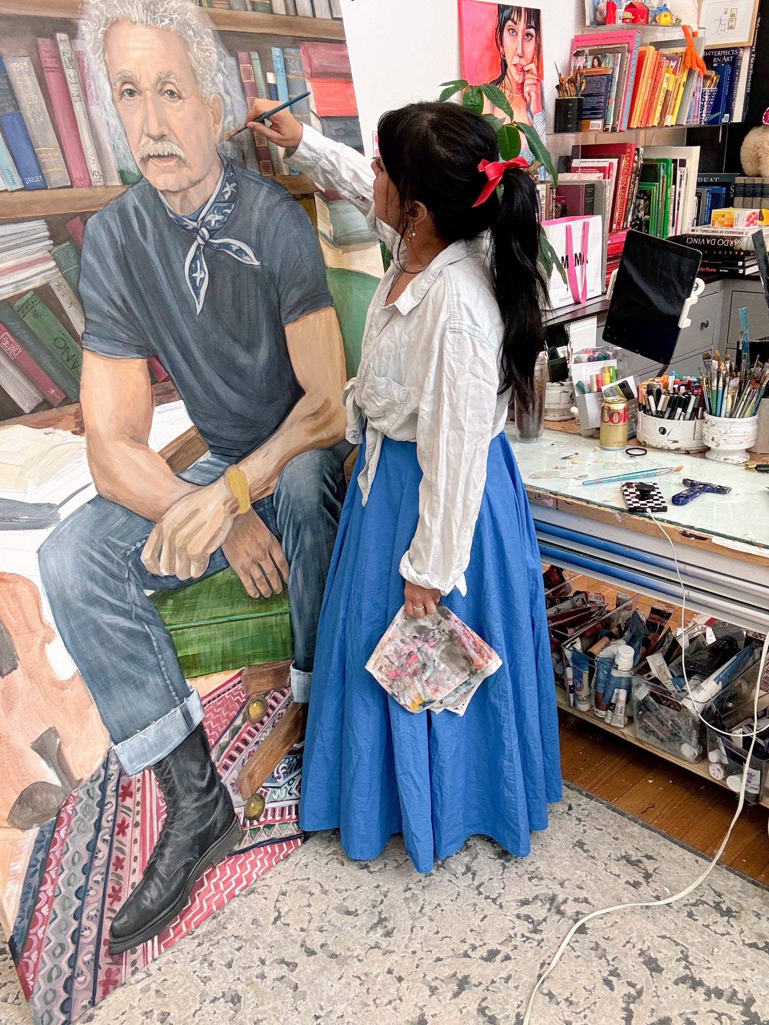 Lindsay Ponce painting in her studio